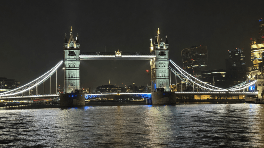 Tower Bridge illuminated at night during a luxury full-day London tour with JM Executive Chauffeur.