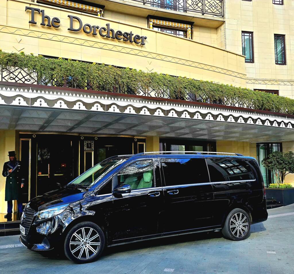 Mercedes V-Class chauffeur vehicle outside The Dorchester Hotel in London for luxury hotel transfers.